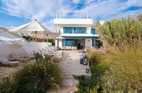 Urbanizacion Costabella Villa | Beachfront Villa with Heated Pool & Spa