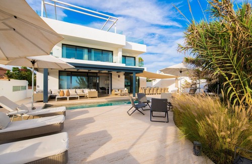 Urbanizacion Costabella Villa | Beachfront Villa with Heated Pool & Spa