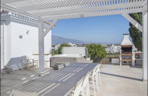 Puerto Banus Villa | Elegant Villa Retreat with Lush Gardens by Lodgerstrip