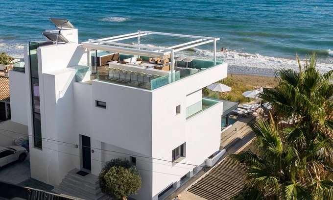 Urbanizacion Costabella Villa | Beachfront Villa with Heated Pool & Spa