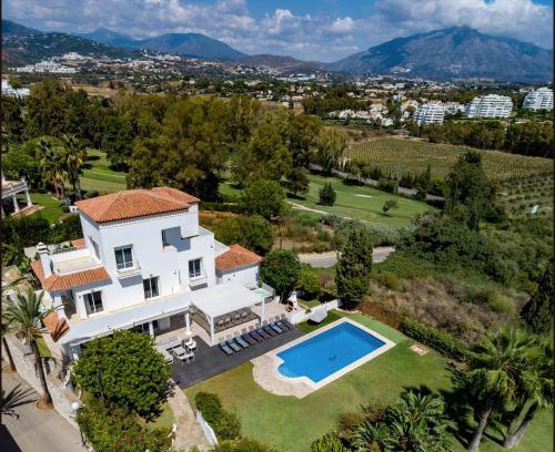Puerto Banus Villa | Elegant Villa Retreat with Lush Gardens by Lodgerstrip